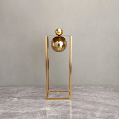 Geometric Abstract Sculpture Featuring Sphere and Gold Metal Frame