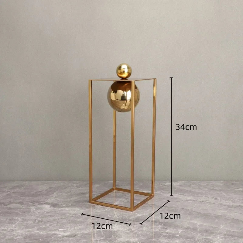 Geometric Abstract Sculpture Featuring Sphere and Gold Metal Frame
