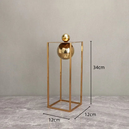 Geometric Abstract Sculpture Featuring Sphere and Gold Metal Frame