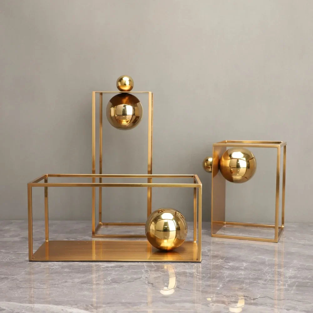 Geometric Abstract Sculpture Featuring Sphere and Gold Metal Frame